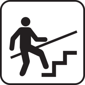 手すりにつかまりながら階段を上る人