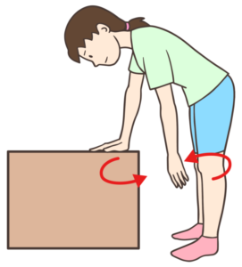 箱に手をつき腕を回す人