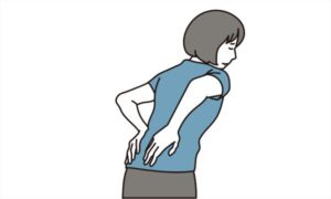 腰を両手で抑える女性