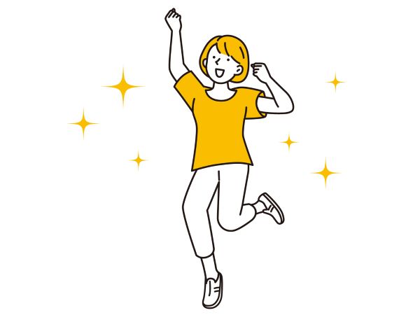 ガッツポーズをする女性